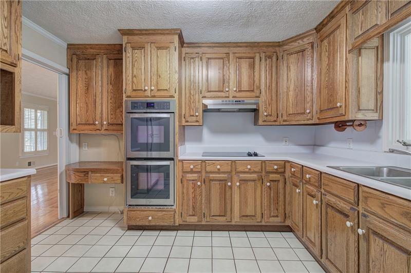 408 Mac Johnson Road Northwest Cartersville, GA 30121 - Photo 20 of 65 a kitchen with stainless steel appliances granite countertop a stove and cabinets