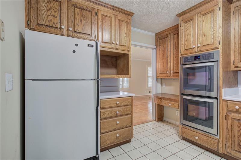 408 Mac Johnson Road Northwest Cartersville, GA 30121 - Photo 21 of 65 a kitchen with stainless steel appliances granite countertop a refrigerator and cabinets