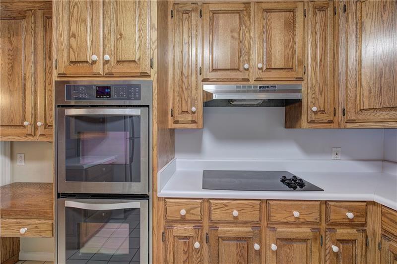 408 Mac Johnson Road Northwest Cartersville, GA 30121 - Photo 26 of 65 a kitchen with granite countertop a stove and a fireplace
