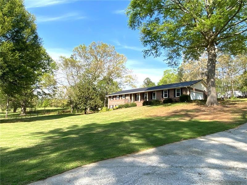 408 Mac Johnson Road Northwest Cartersville, GA 30121 - Photo 3 of 65 a view of a house with a big yard