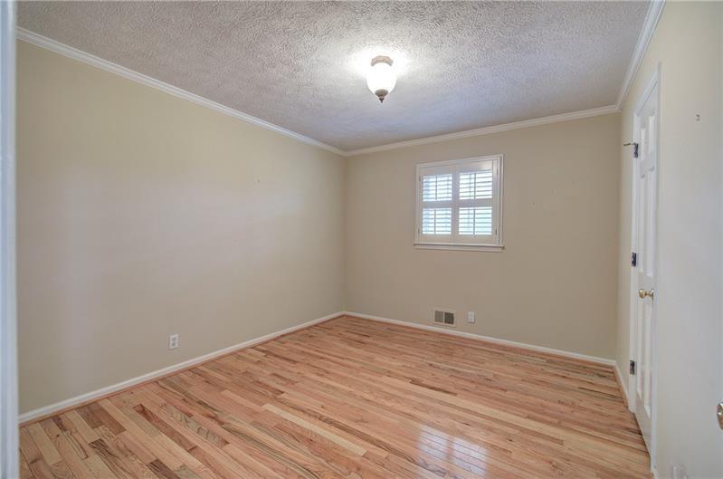 408 Mac Johnson Road Northwest Cartersville, GA 30121 - Photo 31 of 65 wooden floor in an empty room with a window