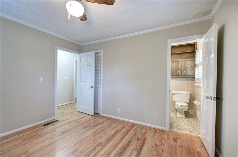 408 Mac Johnson Road Northwest Cartersville, GA 30121 - Photo 36 of 65 a view of a room with wooden floor and bathroom