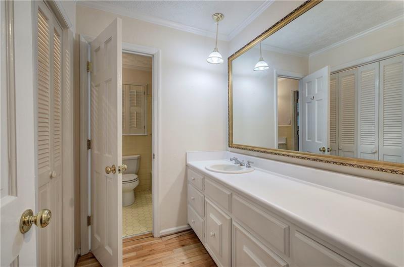 408 Mac Johnson Road Northwest Cartersville, GA 30121 - Photo 41 of 65 a bathroom with a sink and mirror