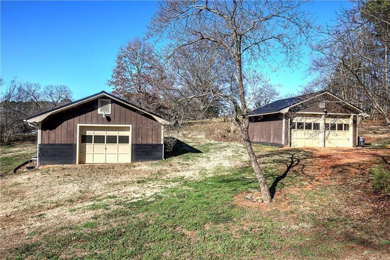 408 Mac Johnson Road Northwest Cartersville, GA 30121 - Photo 60 of 65 a house with trees in the background
