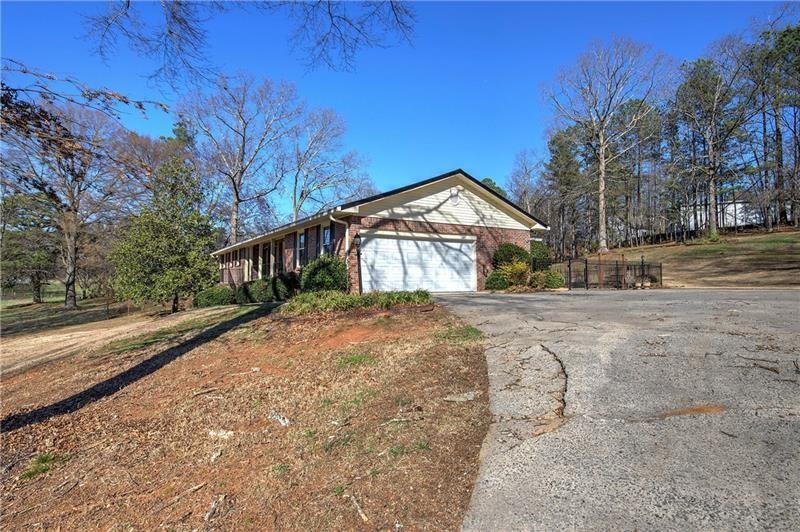 408 Mac Johnson Road Northwest Cartersville, GA 30121 - Photo 7 of 65 a view of a house with a yard covered in snow