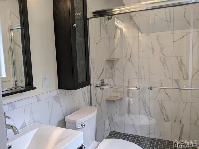 a bathroom with a sink and toilet