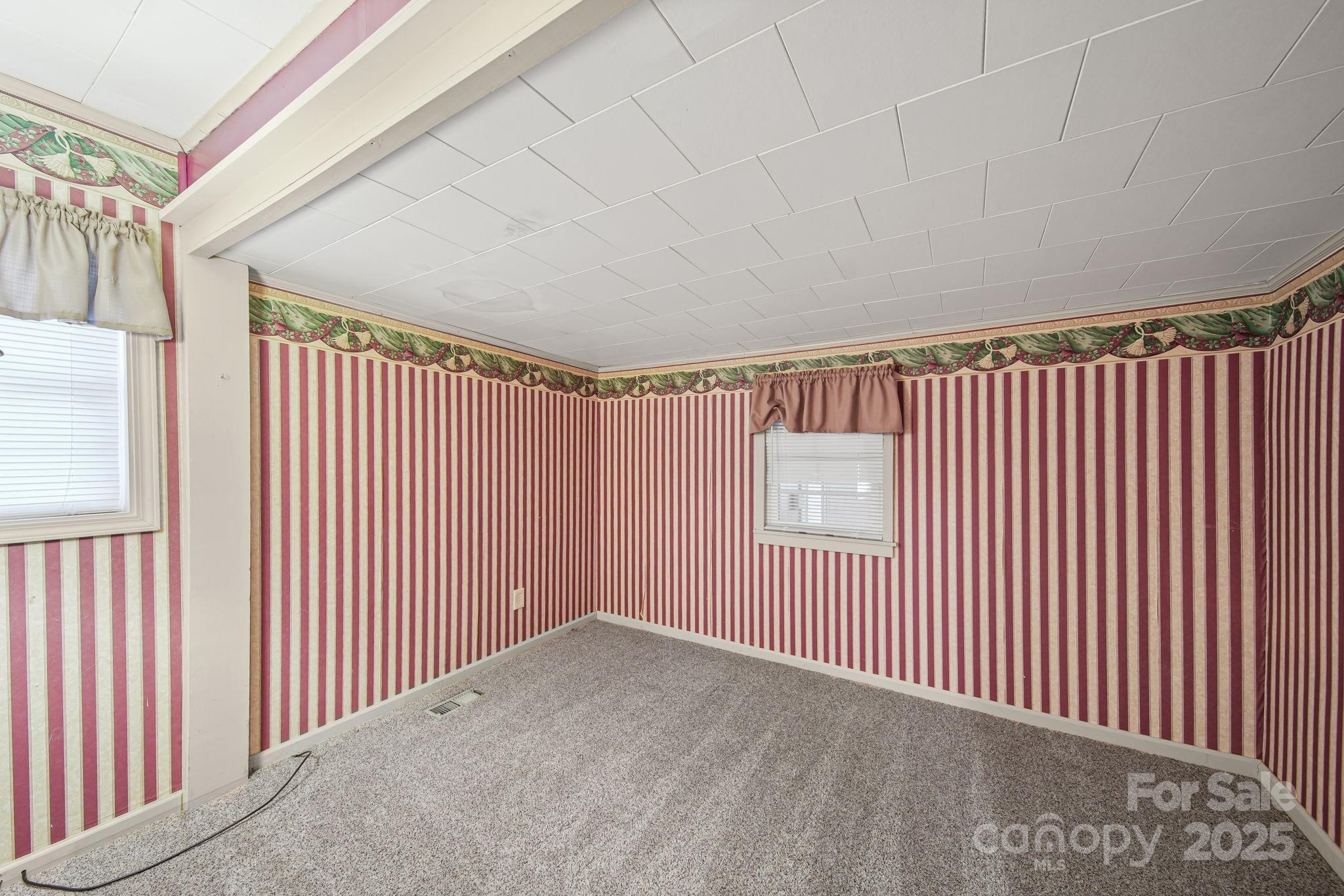 210 Smith Street Clover, SC 29710 - Photo 11 of 33 a view of a hallway with a wooden floor
