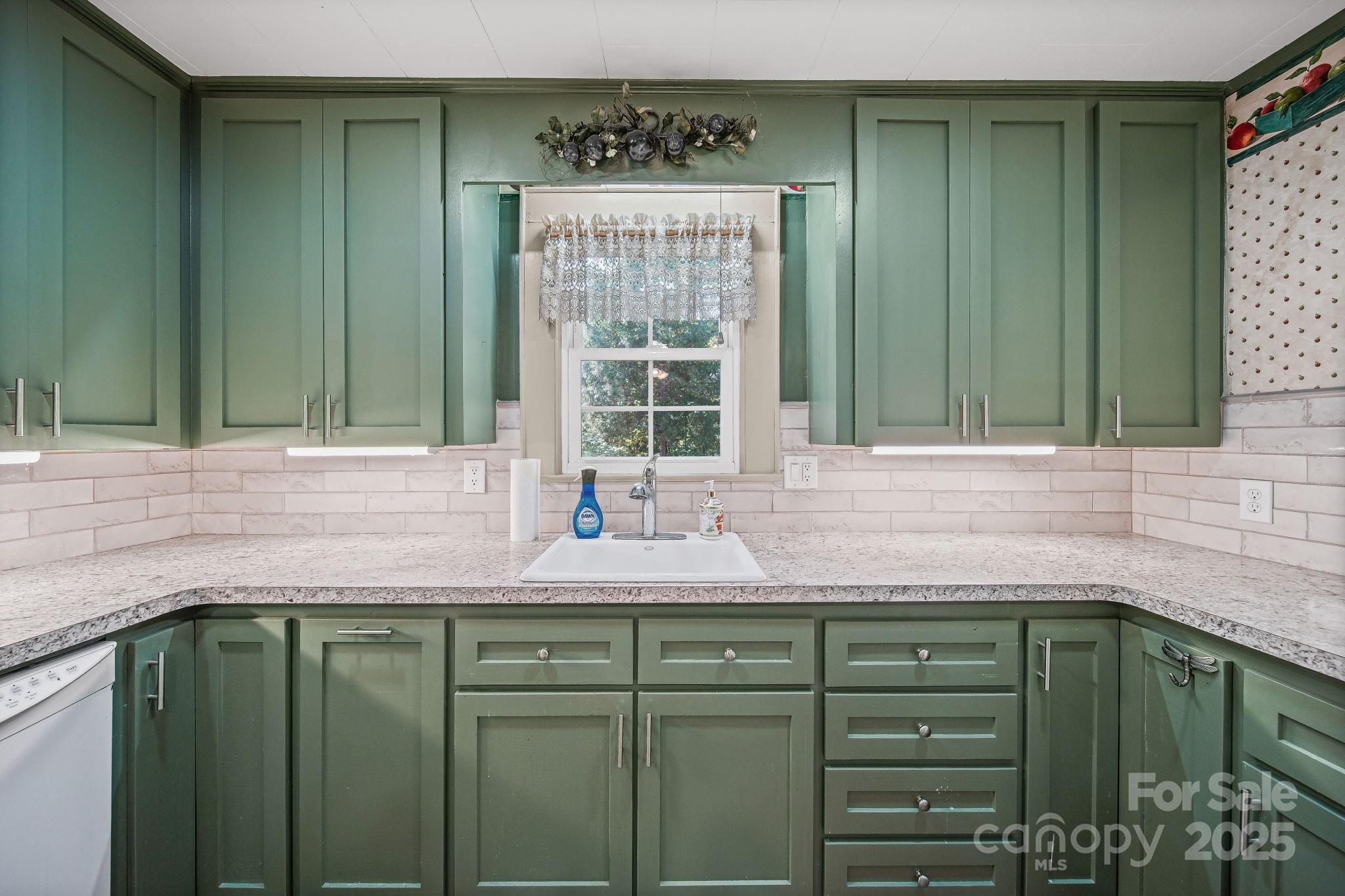 210 Smith Street Clover, SC 29710 - Photo 12 of 33 a bathroom with a sink and a window