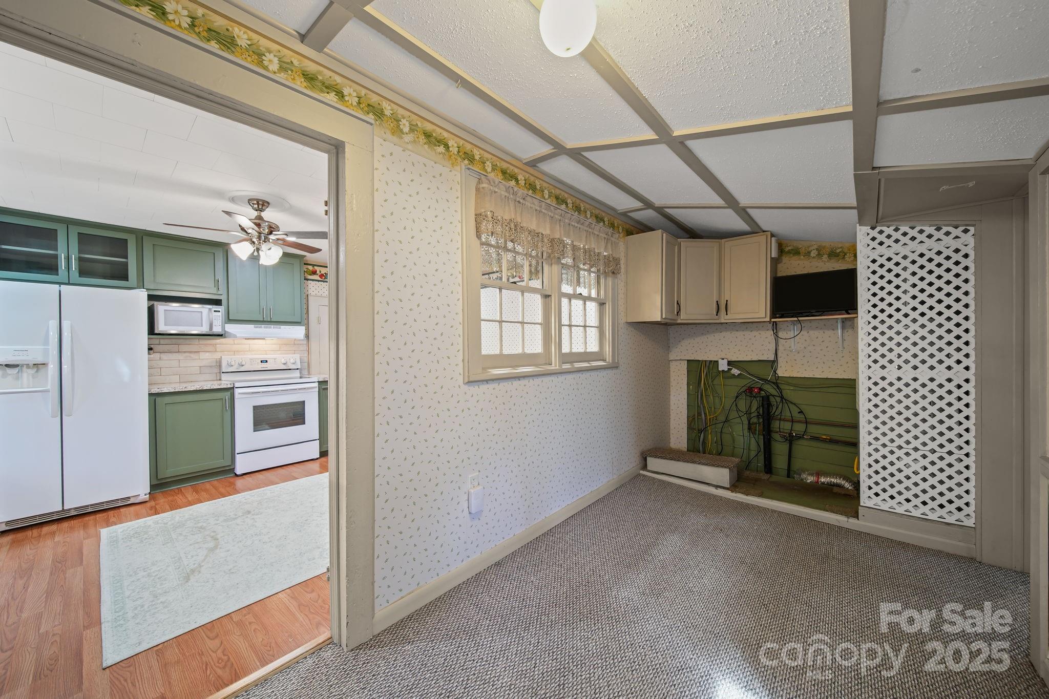 210 Smith Street Clover, SC 29710 - Photo 16 of 33 a view of a kitchen with a sink cabinets and a window