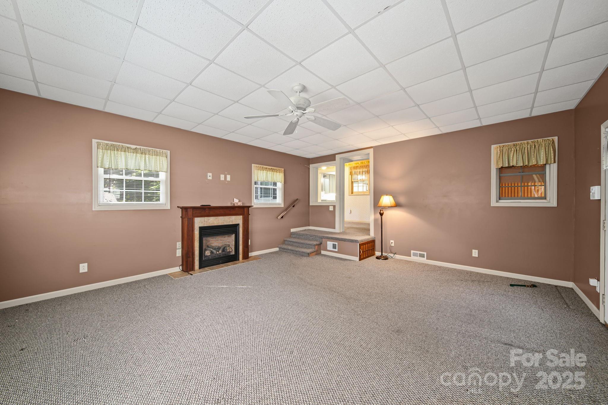 210 Smith Street Clover, SC 29710 - Photo 18 of 33 a view of a livingroom with a fireplace and window