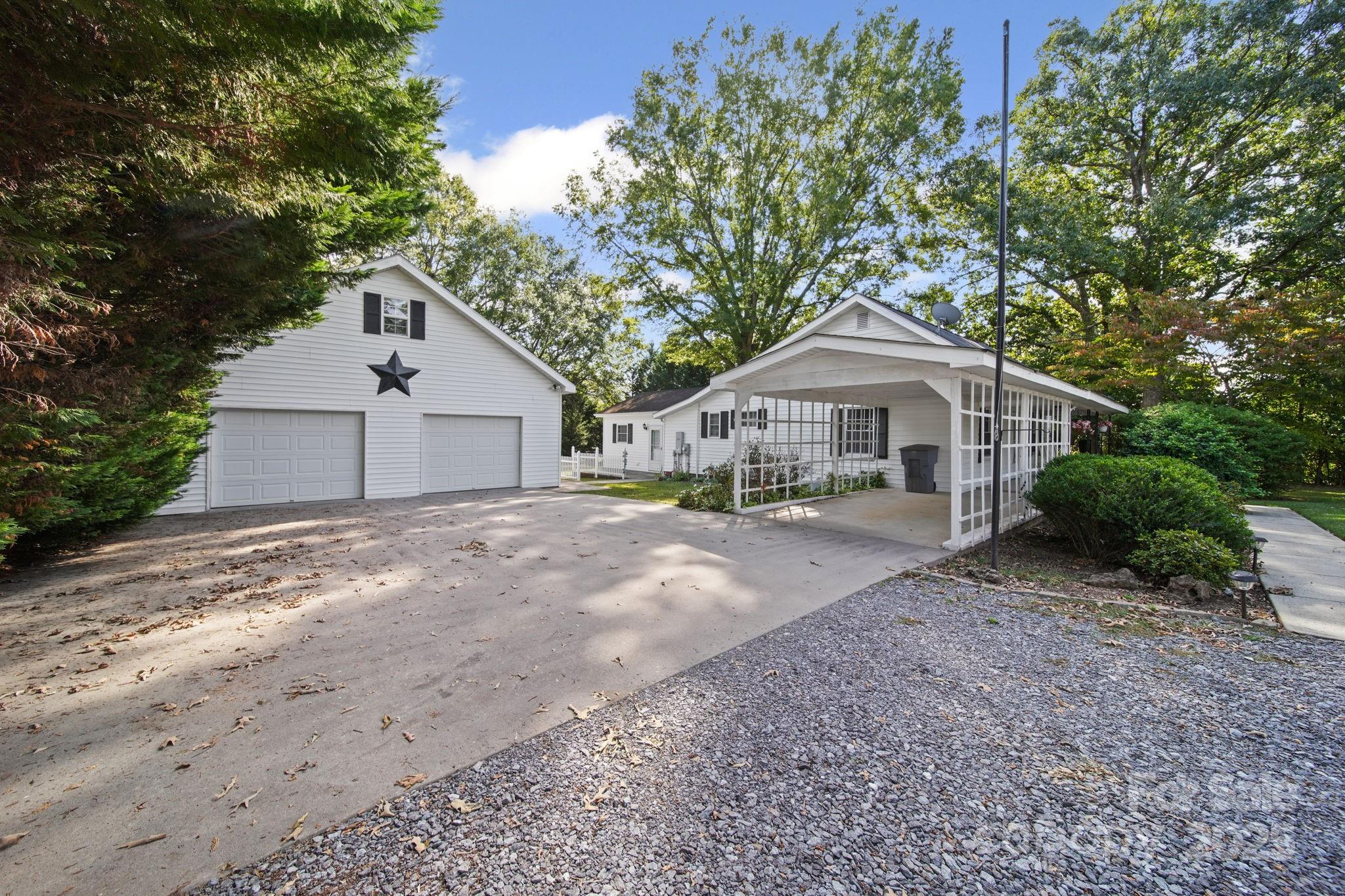 210 Smith Street Clover, SC 29710 - Photo 20 of 33 a front view of a house with a yard and garage