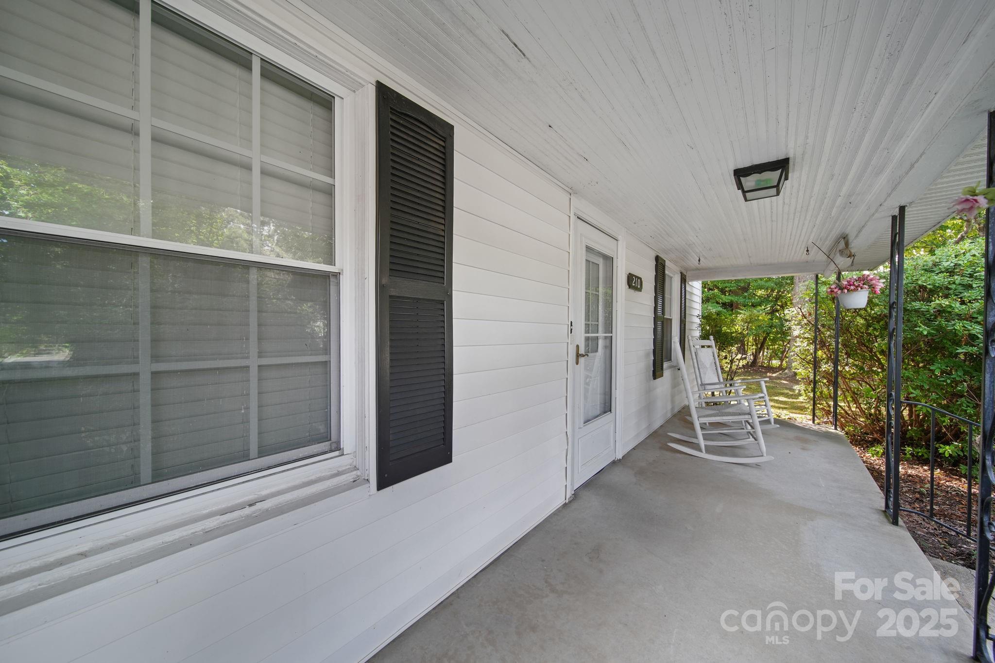 210 Smith Street Clover, SC 29710 - Photo 2 of 33 a view of front door and porch with seating space