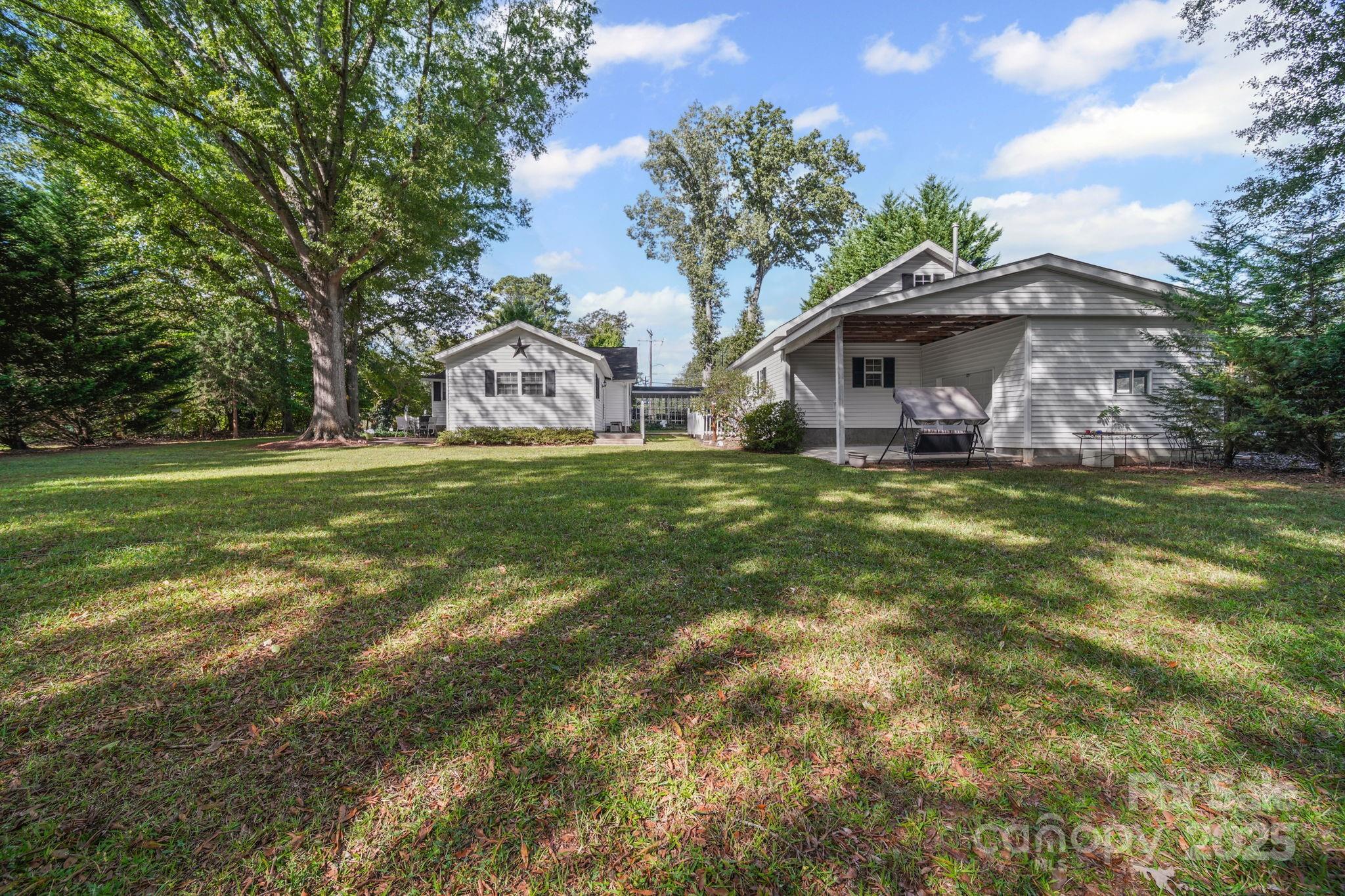 210 Smith Street Clover, SC 29710 - Photo 29 of 33 a front view of a house with a garden