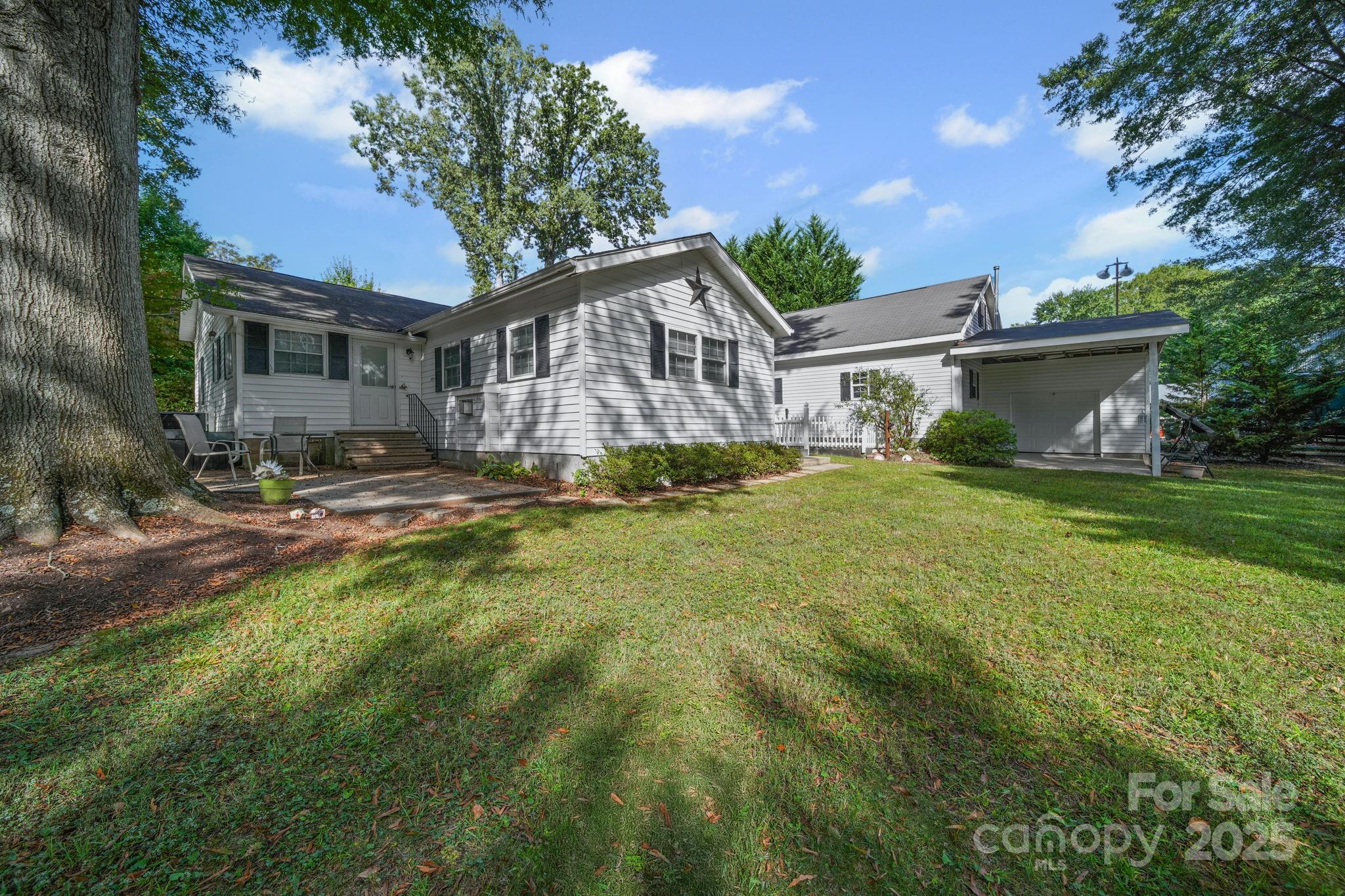 210 Smith Street Clover, SC 29710 - Photo 30 of 33 a yard that is sitting in front of a house