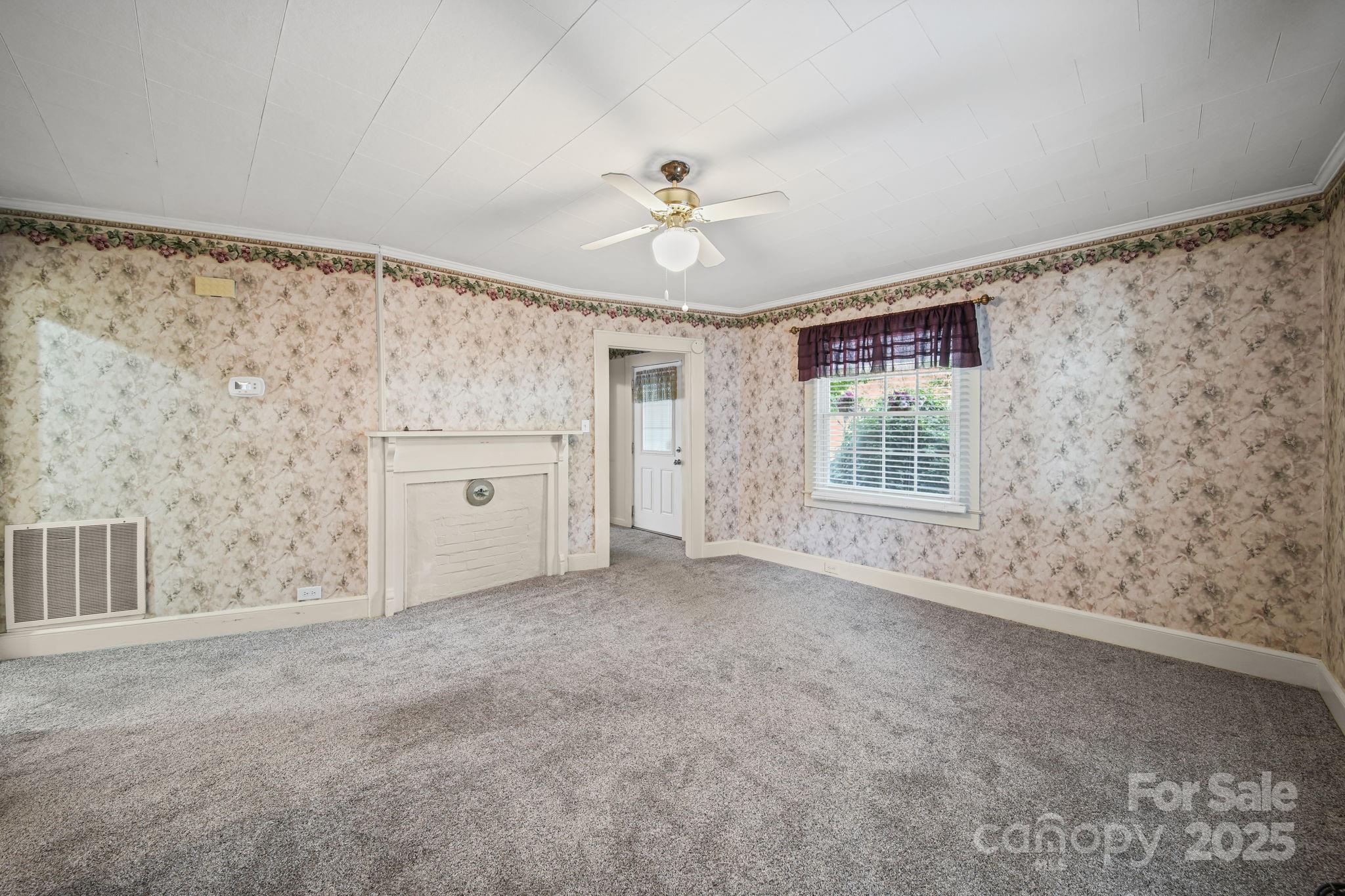 210 Smith Street Clover, SC 29710 - Photo 5 of 33 a view of an empty room with a window