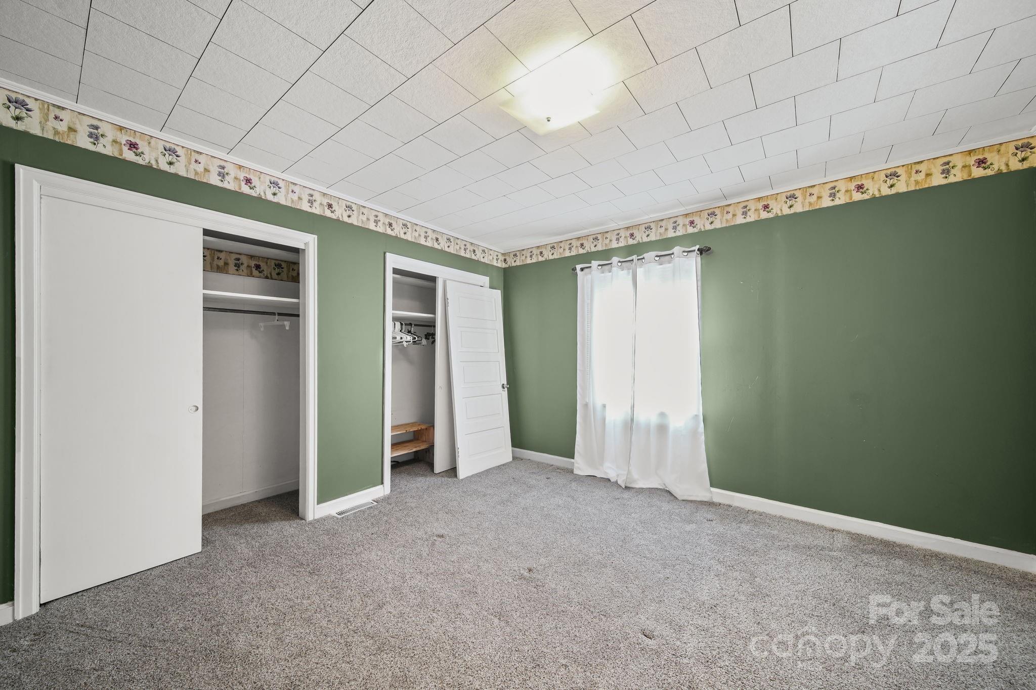 210 Smith Street Clover, SC 29710 - Photo 6 of 33 a view of an empty room with a window