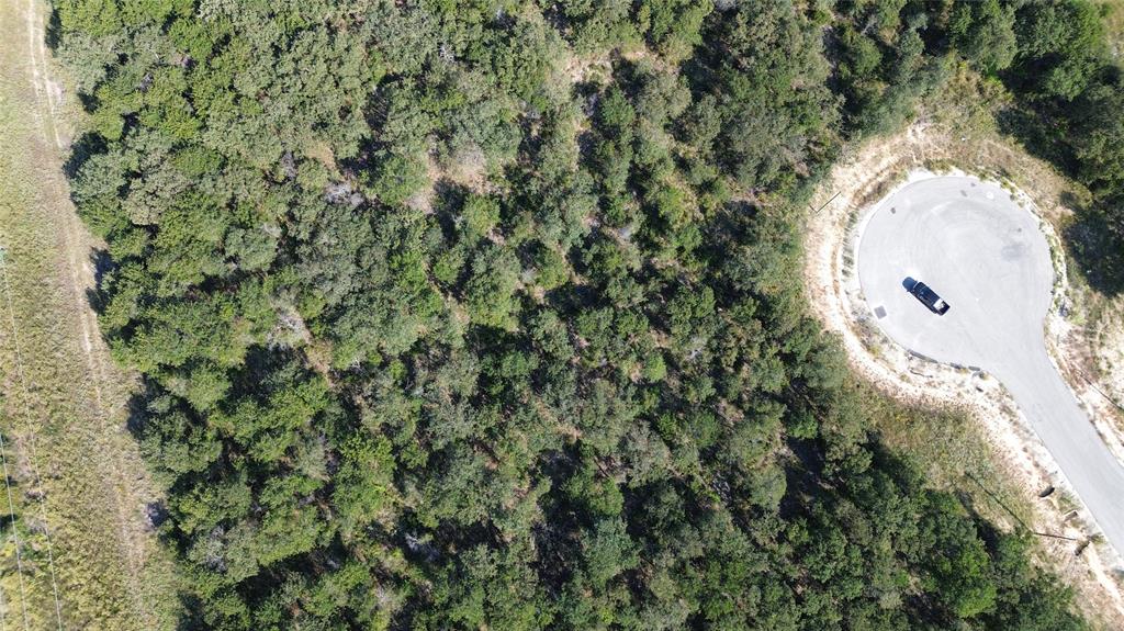 507 Ken Road Tolar, TX 76476 - Photo 4 of 4 with aerial view of a house with a yard and garden