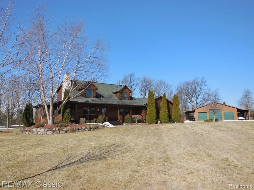 2447 North Hacker Road Howell, MI 48855 - Photo 1 of 62 2447 N Hacker Rd 10 acre Log House paradise