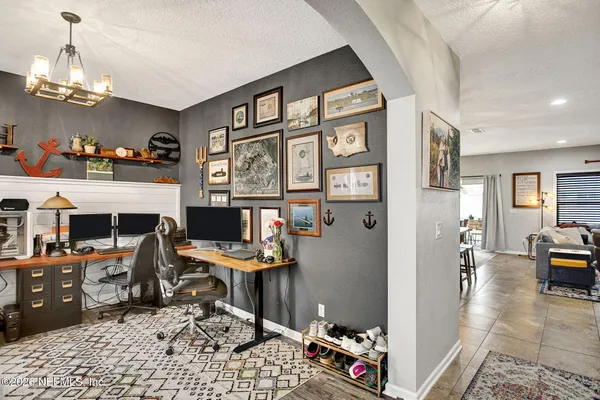 a bathroom with a sink a toilet and shower curtain