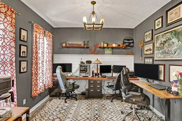 a bathroom with a tub a sink and a mirror