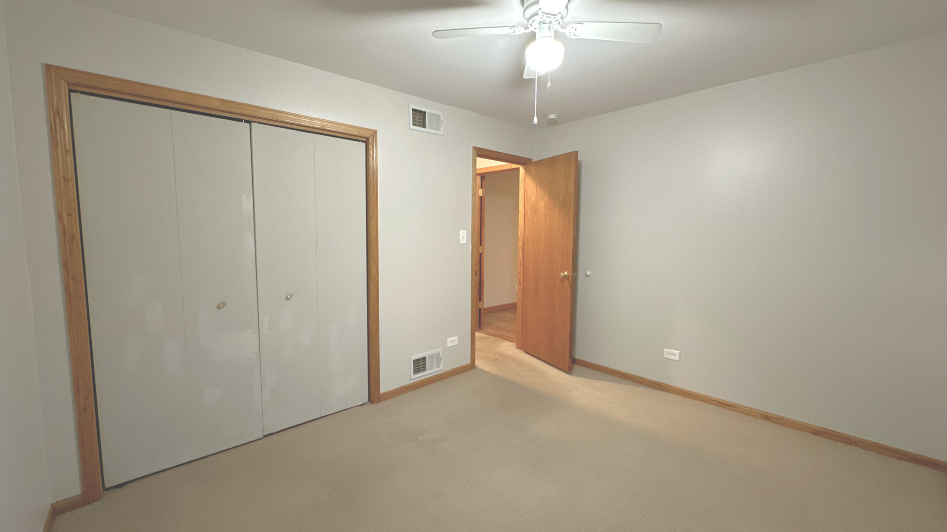 18210 Perth Avenue Homewood, IL 60430 - Photo 20 of 23 a view of an empty room with a chandelier fan