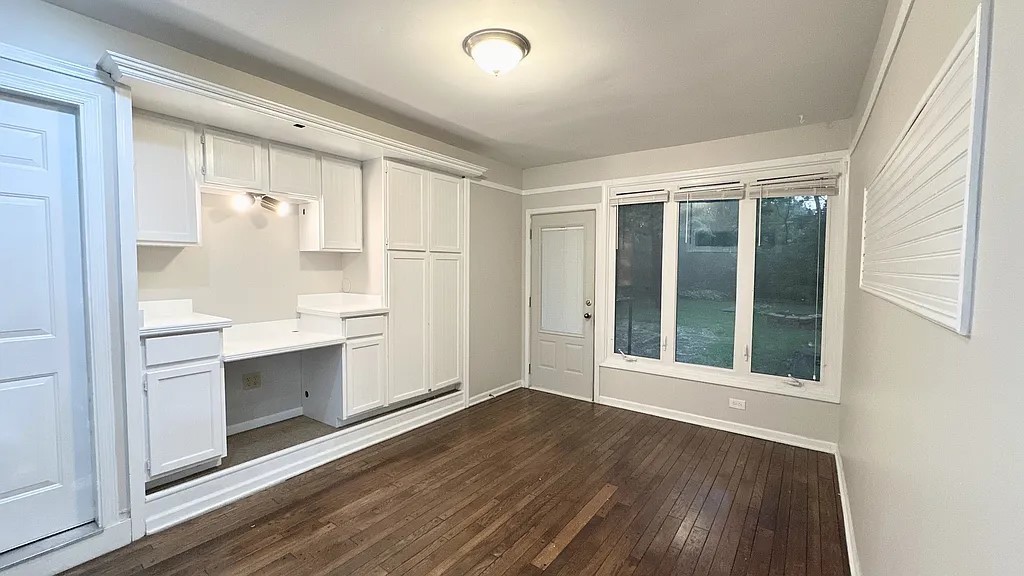 18210 Perth Avenue Homewood, IL 60430 - Photo 4 of 23 a view of an empty room with cabinet and a window