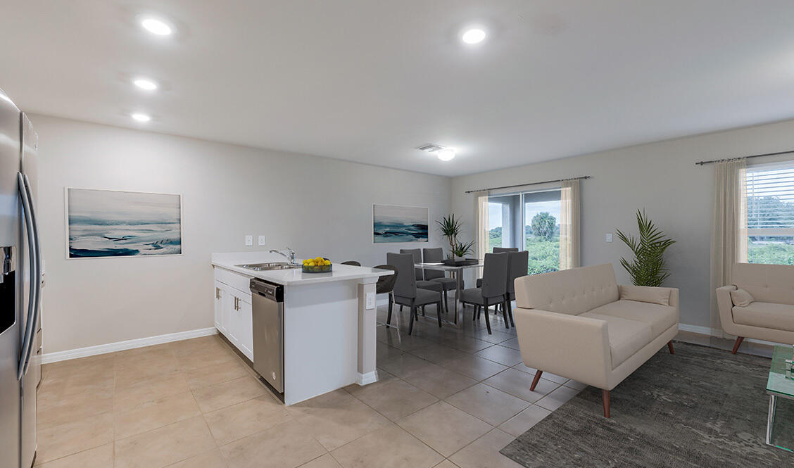 334 Flounder Street Crestview, FL 32539 - Photo 9 of 24 a living room with furniture and a dining table with chairs