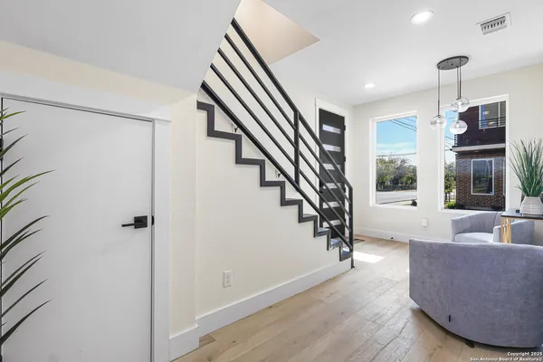 a living room with furniture and windows