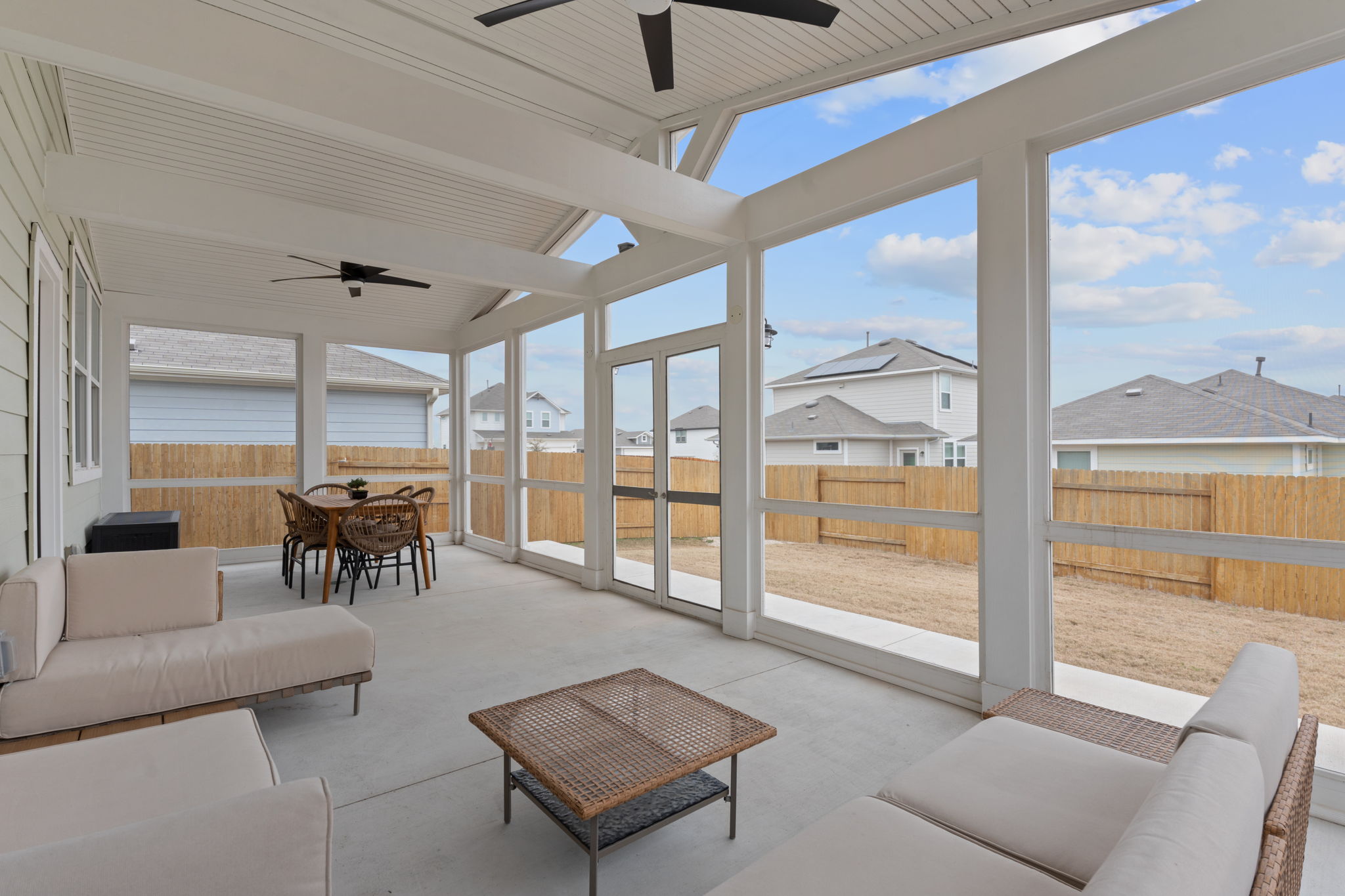 236 Stein Road Georgetown, TX 78626 - Photo 1 of 1 Sunroom with a residential view, a healthy amount of sunlight, and ceiling fan