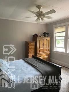 29 Plainfield Avenue Metuchen, NJ 08840 - Photo 8 of 11 a bedroom with a bed and a chandelier