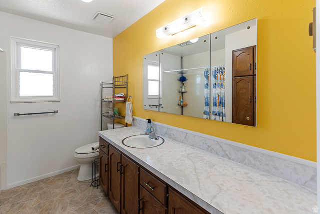 88 West 700 South Payson, UT 84651 - Photo 10 of 27 Full bath featuring vanity, healthy amount of natural light, and a shower with shower curtain