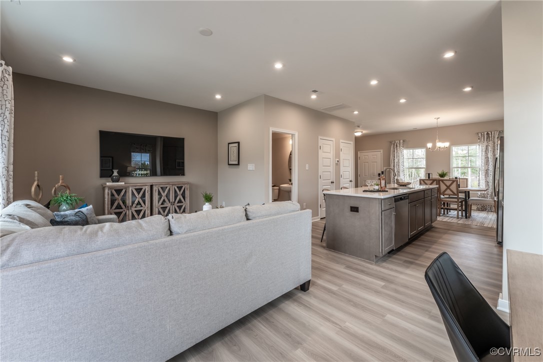 3413 Hopkins Road Richmond, VA 23234 - Photo 11 of 25 a living room with furniture and a flat screen tv