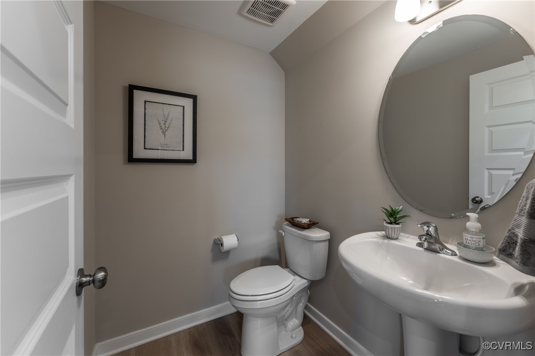 3413 Hopkins Road Richmond, VA 23234 - Photo 9 of 25 a bathroom with a toilet sink and mirror