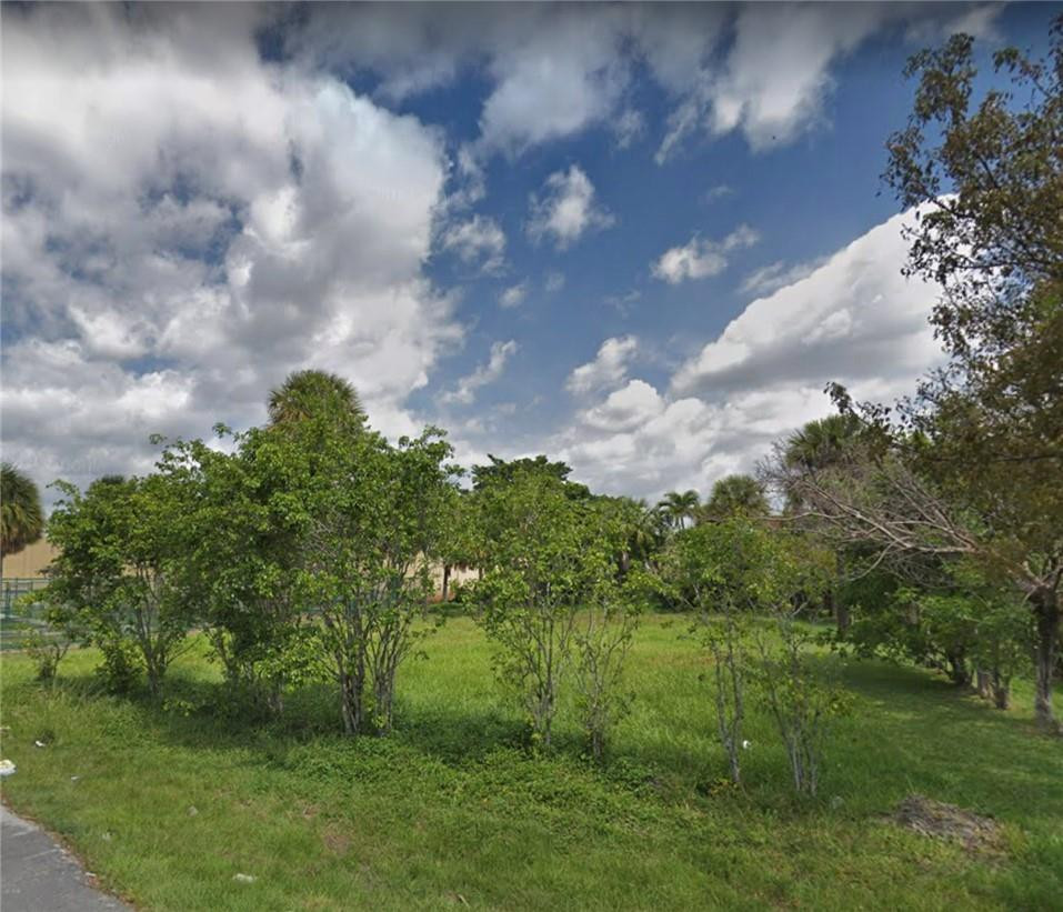 Southwest 2nd Court Pompano Beach, FL 33060 - Photo 2 of 2 a view of a garden with a bench in backyard