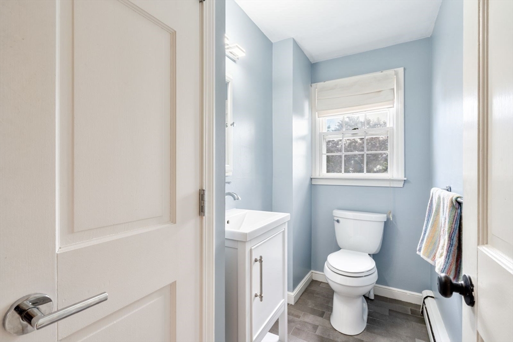 11 Sycamore Road Scituate, MA 02066 - Photo 17 of 39 a white toilet sitting next to a bathroom sink