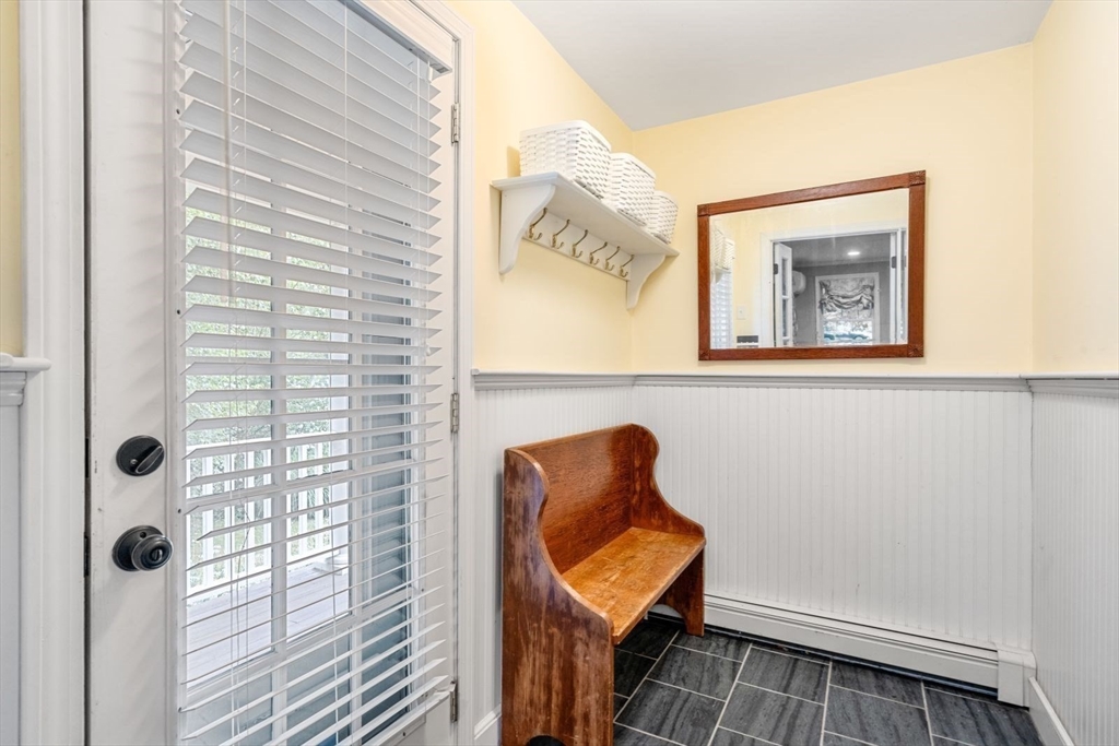 11 Sycamore Road Scituate, MA 02066 - Photo 21 of 39 a bathroom with a toilet and a shower curtain