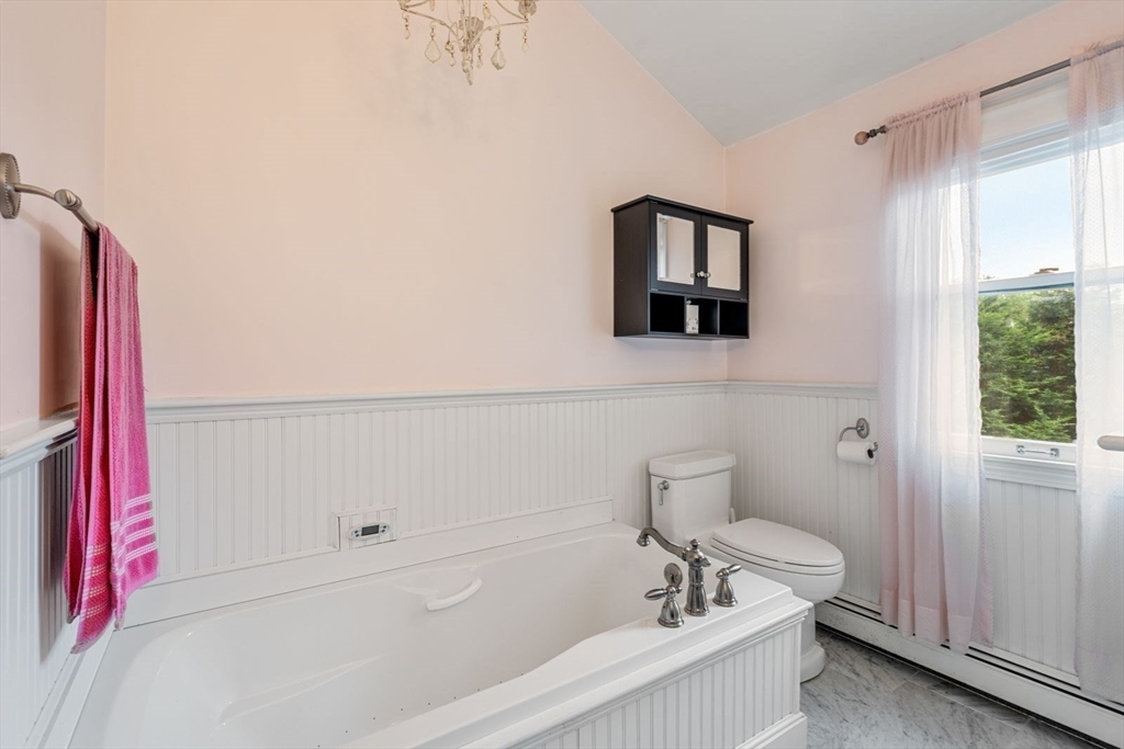 11 Sycamore Road Scituate, MA 02066 - Photo 28 of 39 a bathroom with a bathtub and a shower