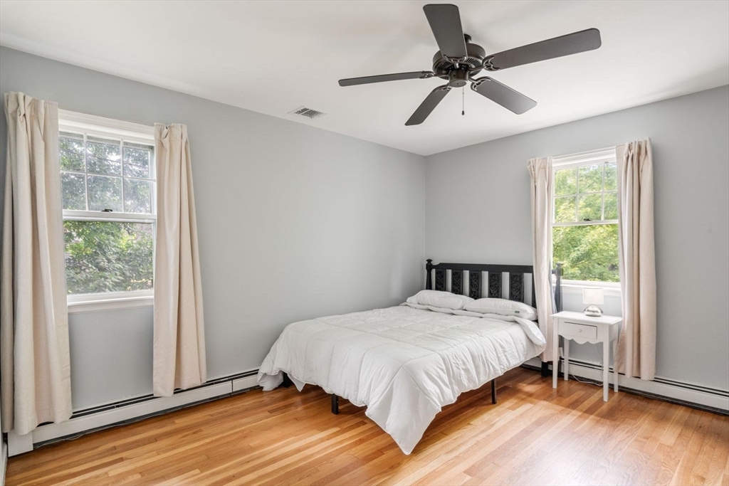 11 Sycamore Road Scituate, MA 02066 - Photo 29 of 39 a bedroom with a bed and a window