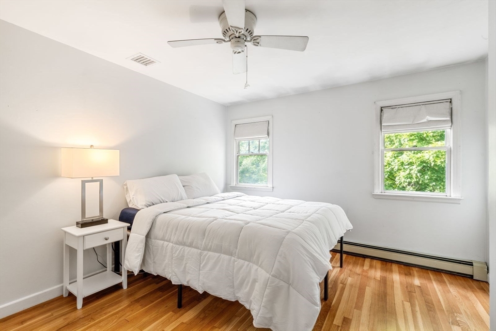 11 Sycamore Road Scituate, MA 02066 - Photo 33 of 39 a bedroom with a bed and a window