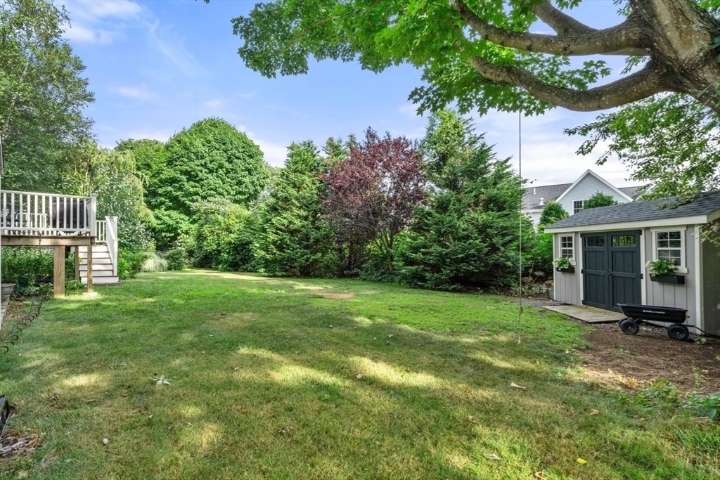 11 Sycamore Road Scituate, MA 02066 - Photo 38 of 39 a view of a house with a backyard