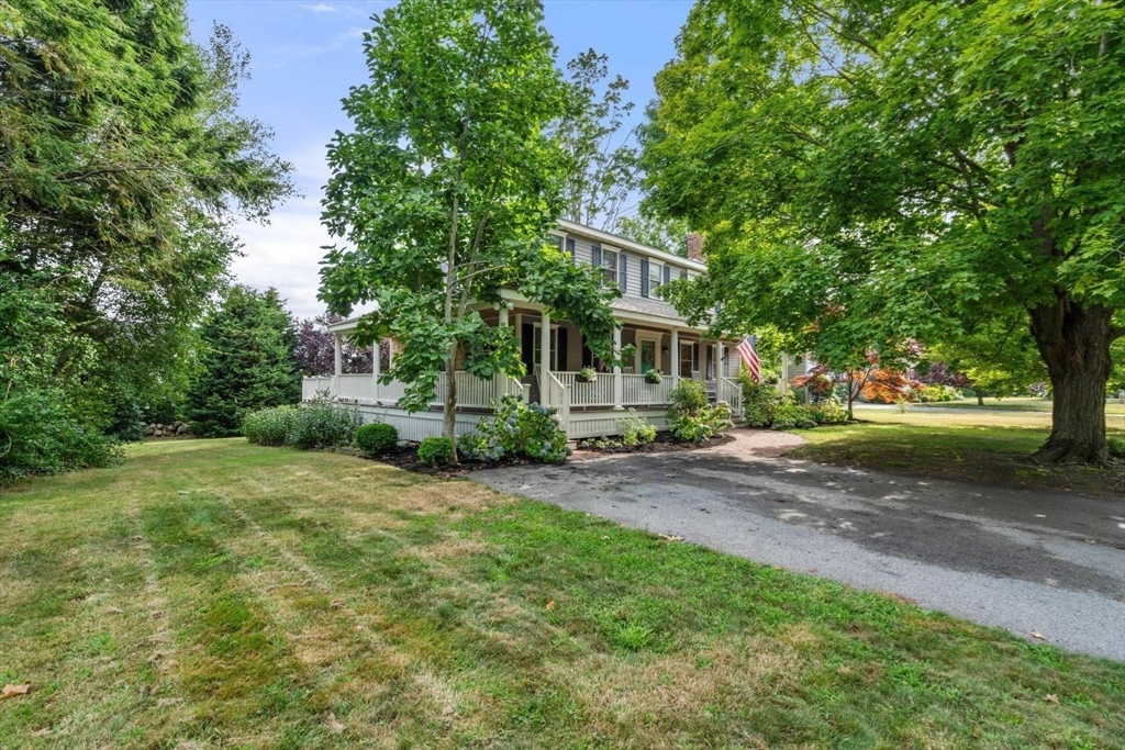 11 Sycamore Road Scituate, MA 02066 - Photo 4 of 39 a view of a yard with plants and trees