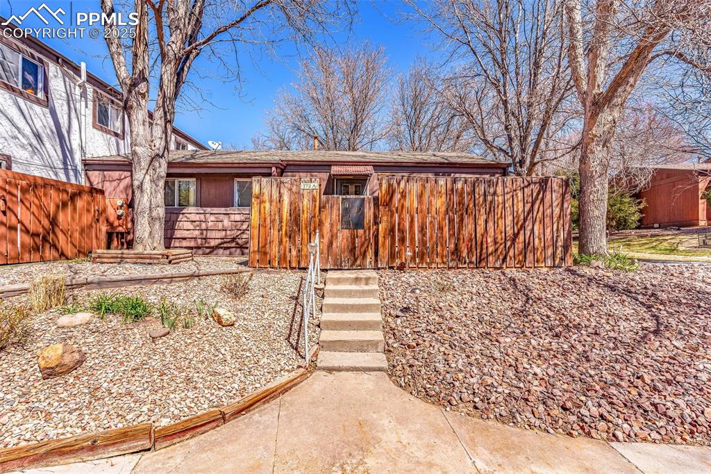 a view of a backyard with large trees