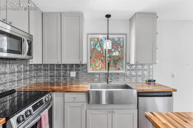 a view of a kitchen with kitchen island and a window