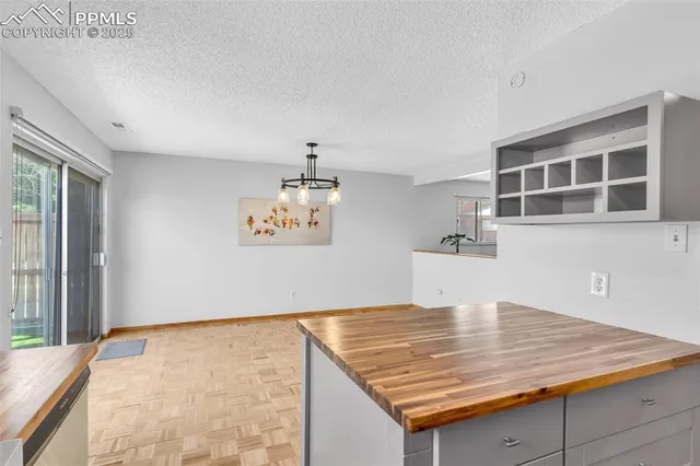 a view of kitchen island with wooden floor