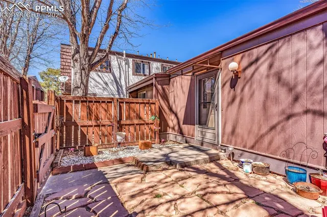 a view of small space with wooden fence