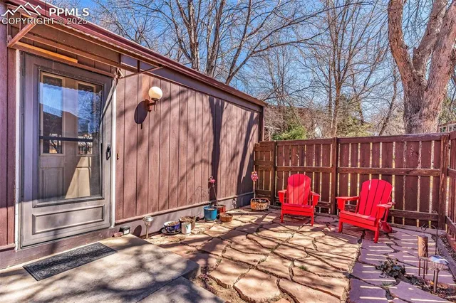 a bedroom with furniture and a chandelier