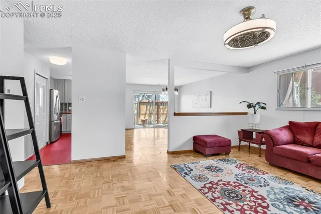 a living room with furniture and a window