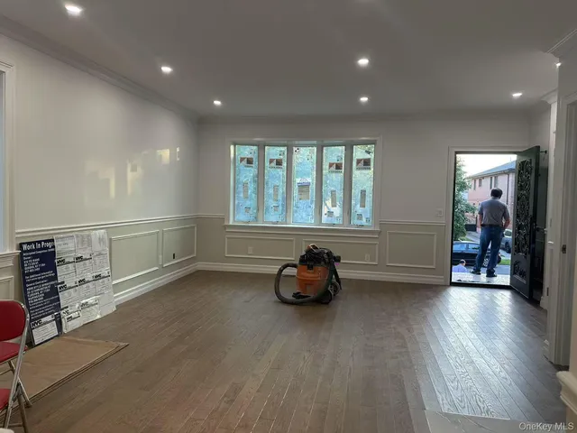 a room with furniture and wooden floor