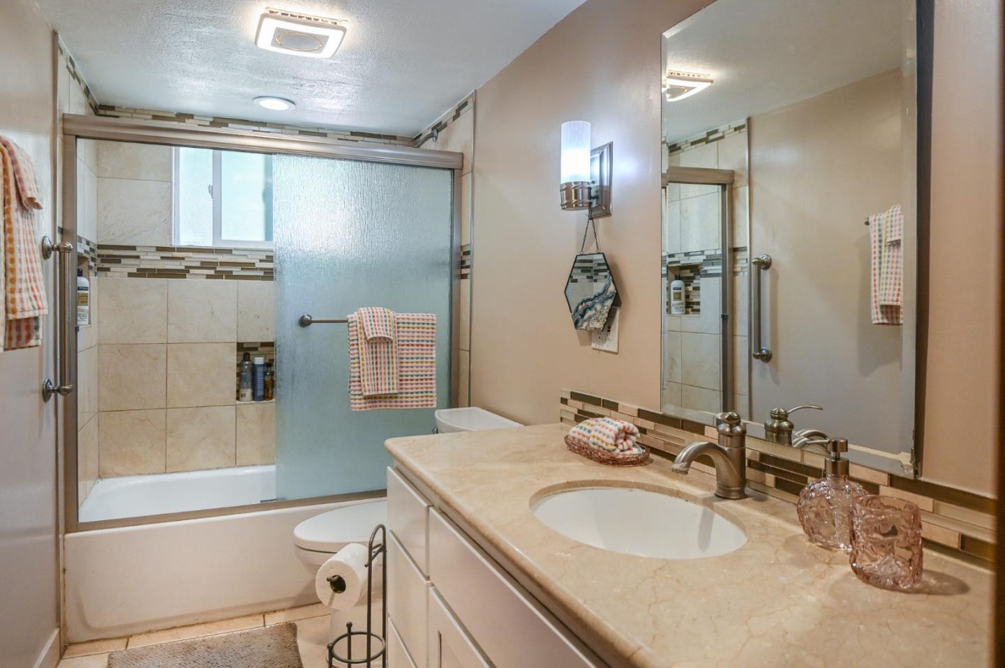 15223 Perry Lane Morgan Hill, CA 95037 - Photo 16 of 31 a bathroom with a granite countertop sink toilet and shower