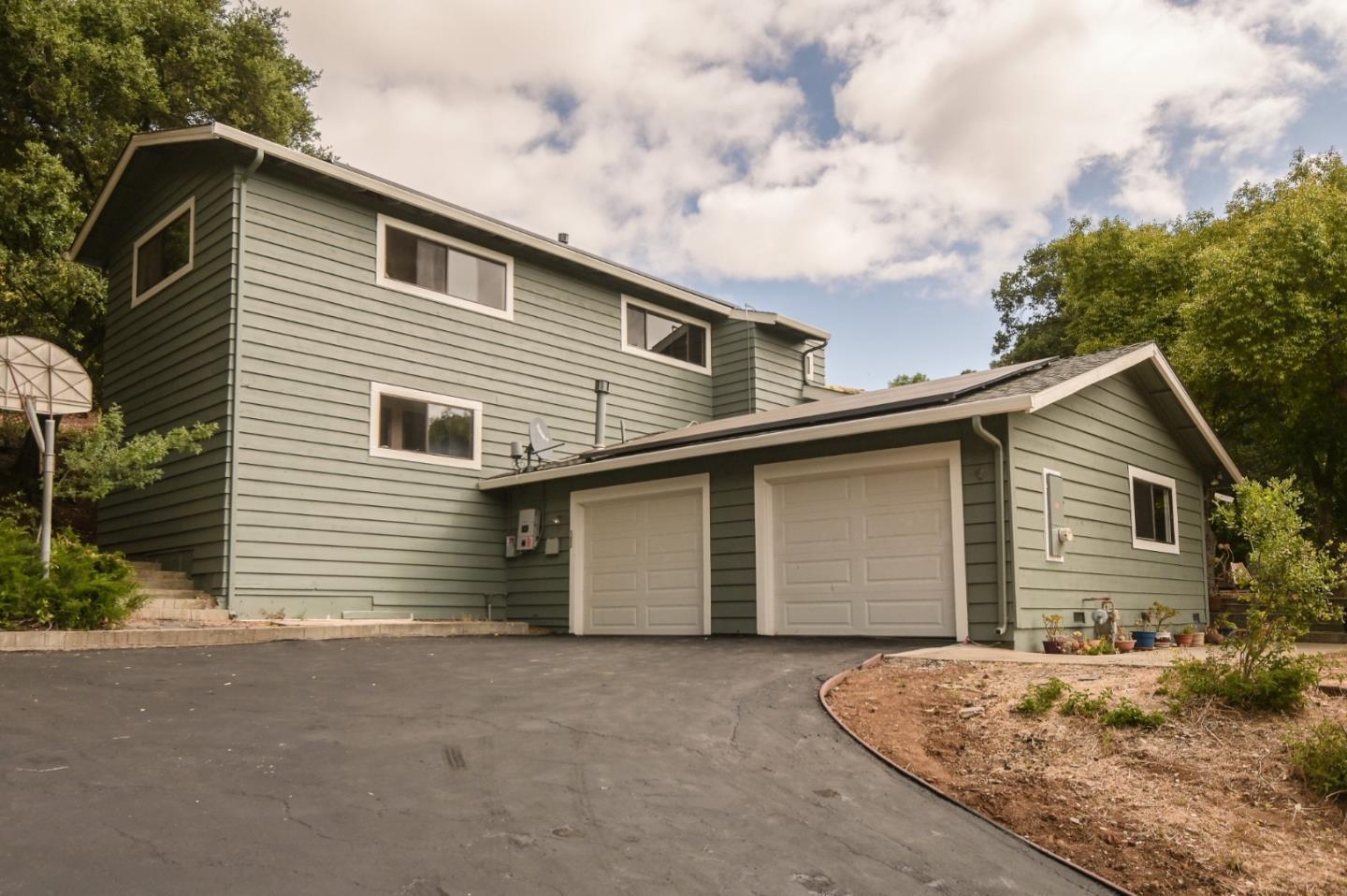 15223 Perry Lane Morgan Hill, CA 95037 - Photo 23 of 31 a front view of a house with a yard and garage